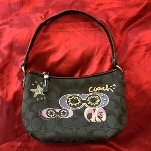 black sunglasses coach saddle bag